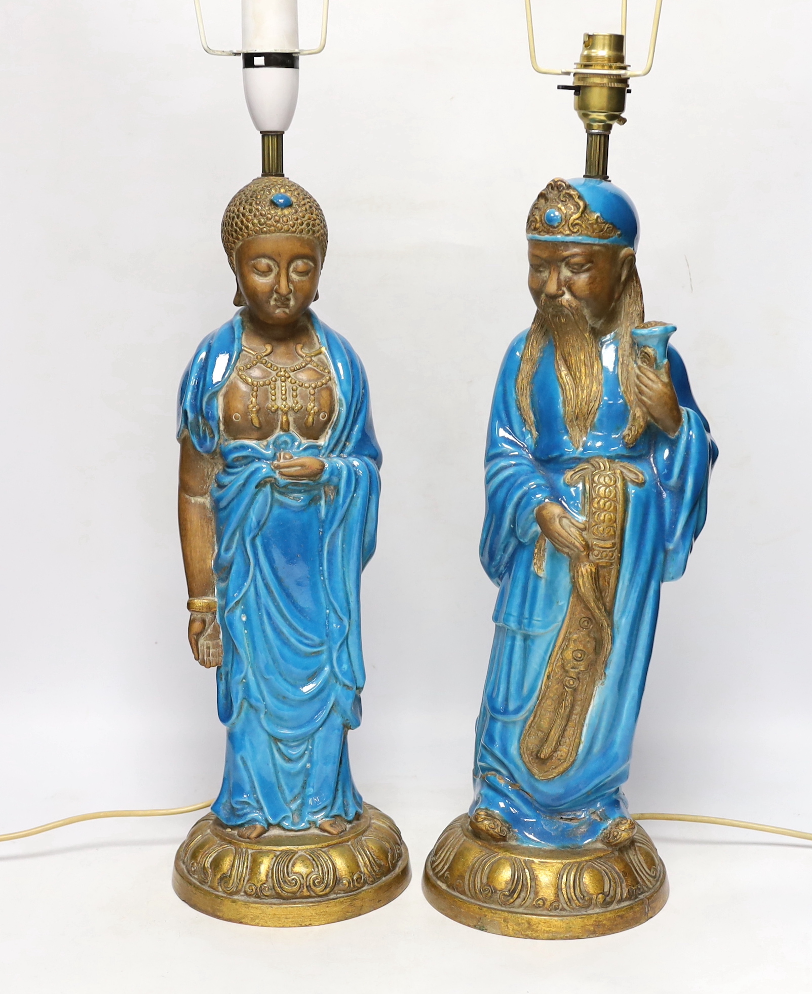 Two Chinese decoratively glazed and gilded pottery figures converted to lamp bases, approximately 44cm high
